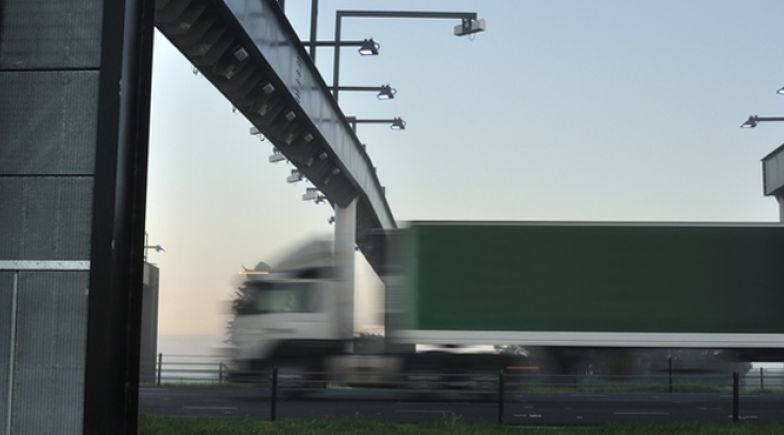 Lorry passing under toll gate